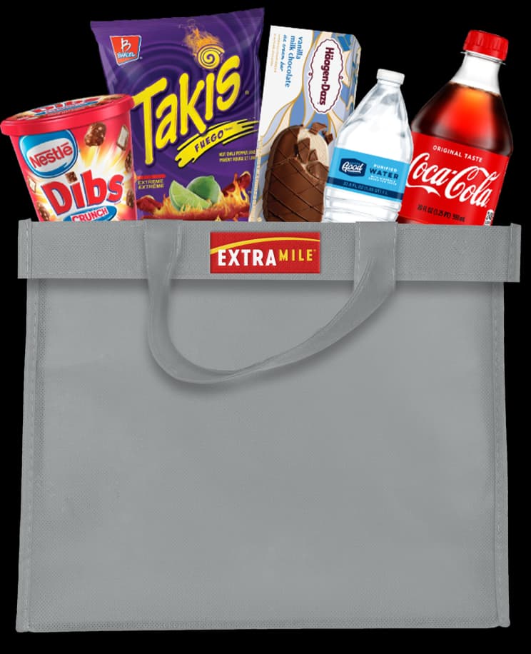 ExtraMile branded tote full of snacks and cold beverages